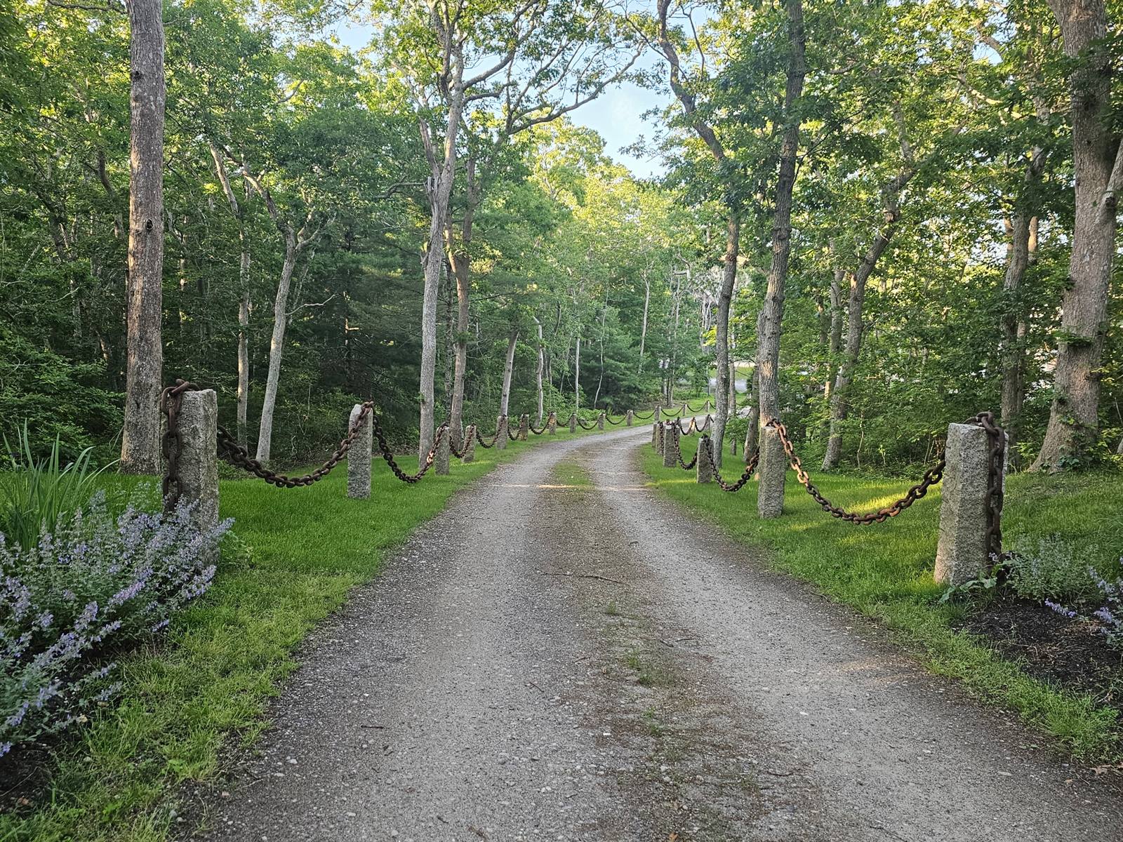 Granite posts and chain lining the private drive to the cul-de-sac