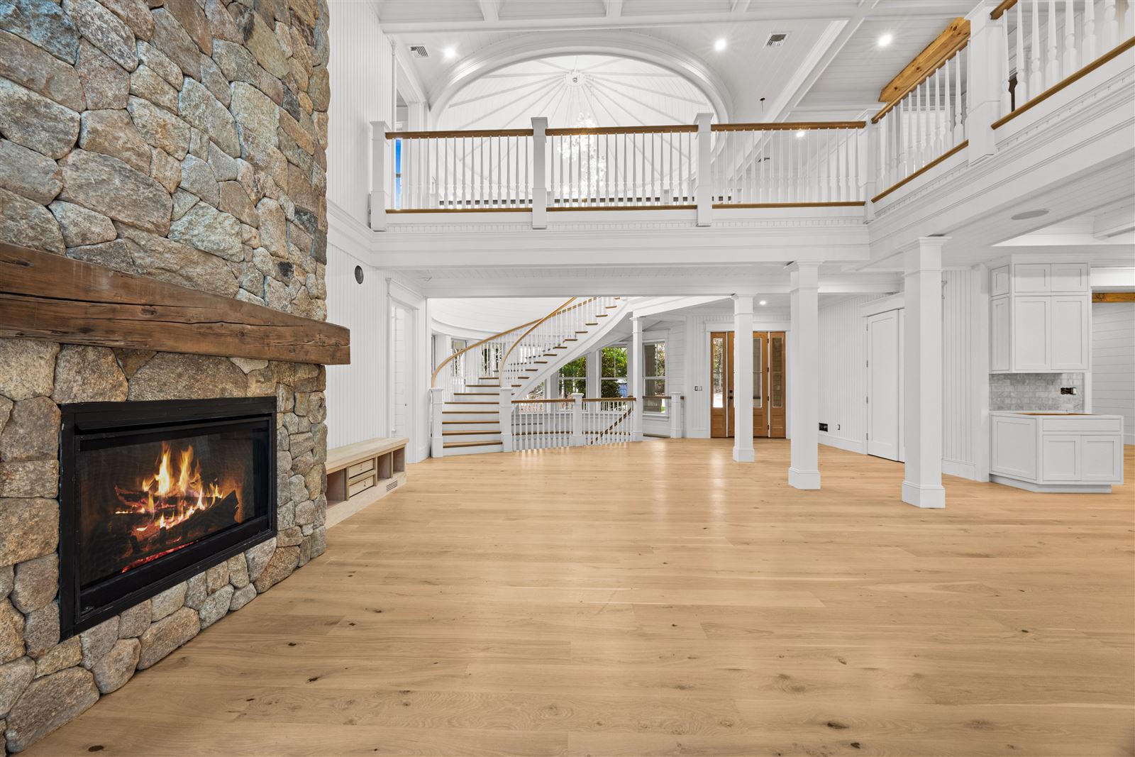 Two-story great room with stone fireplace