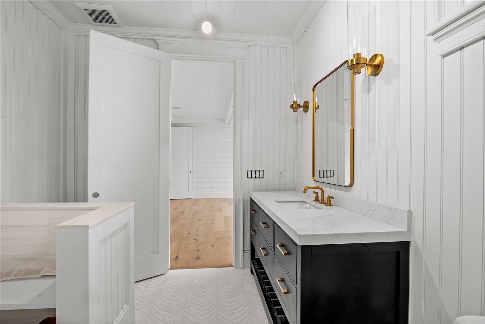 Marble vanity & freestanding soaking tub