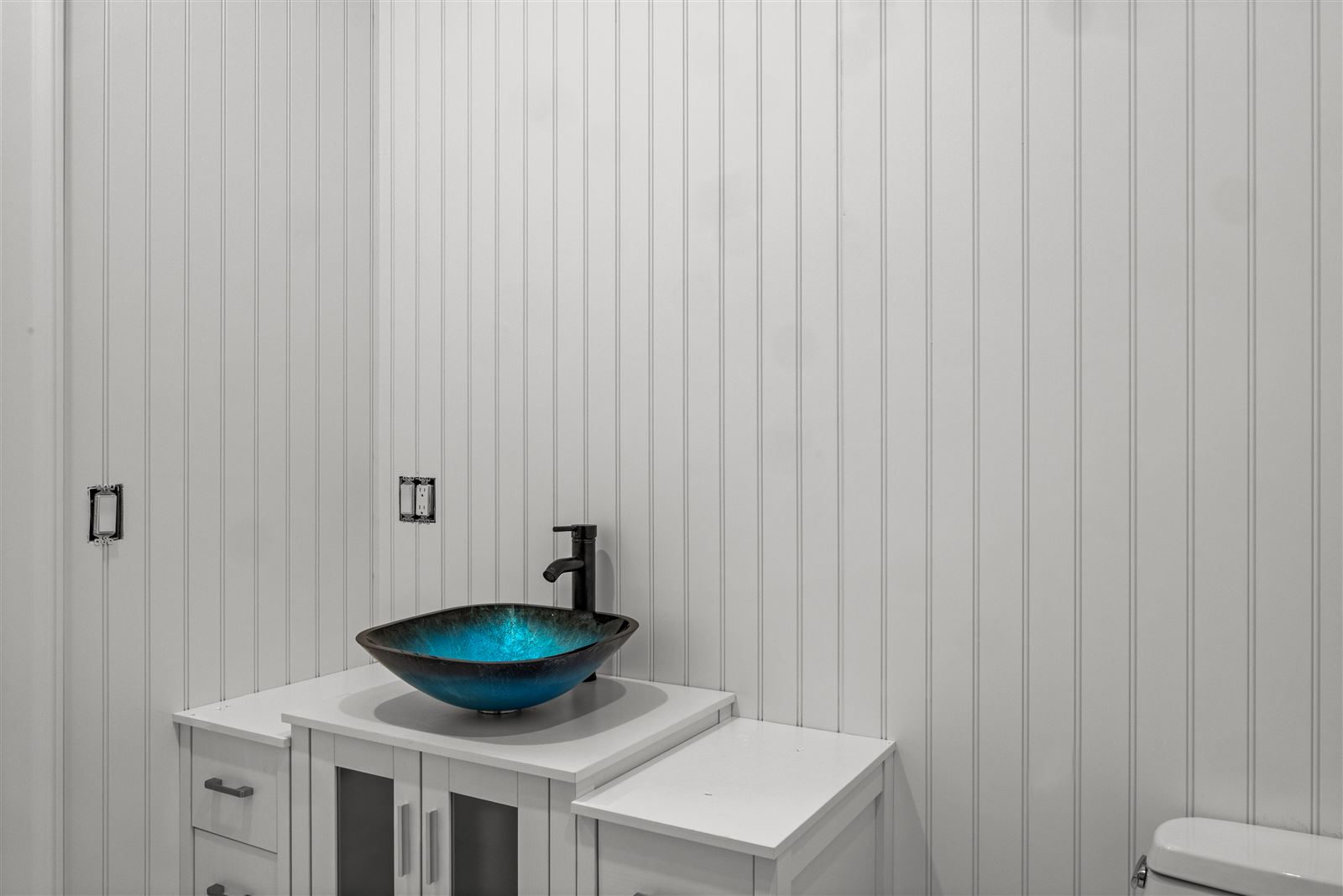 Powder room, blue glass vessel